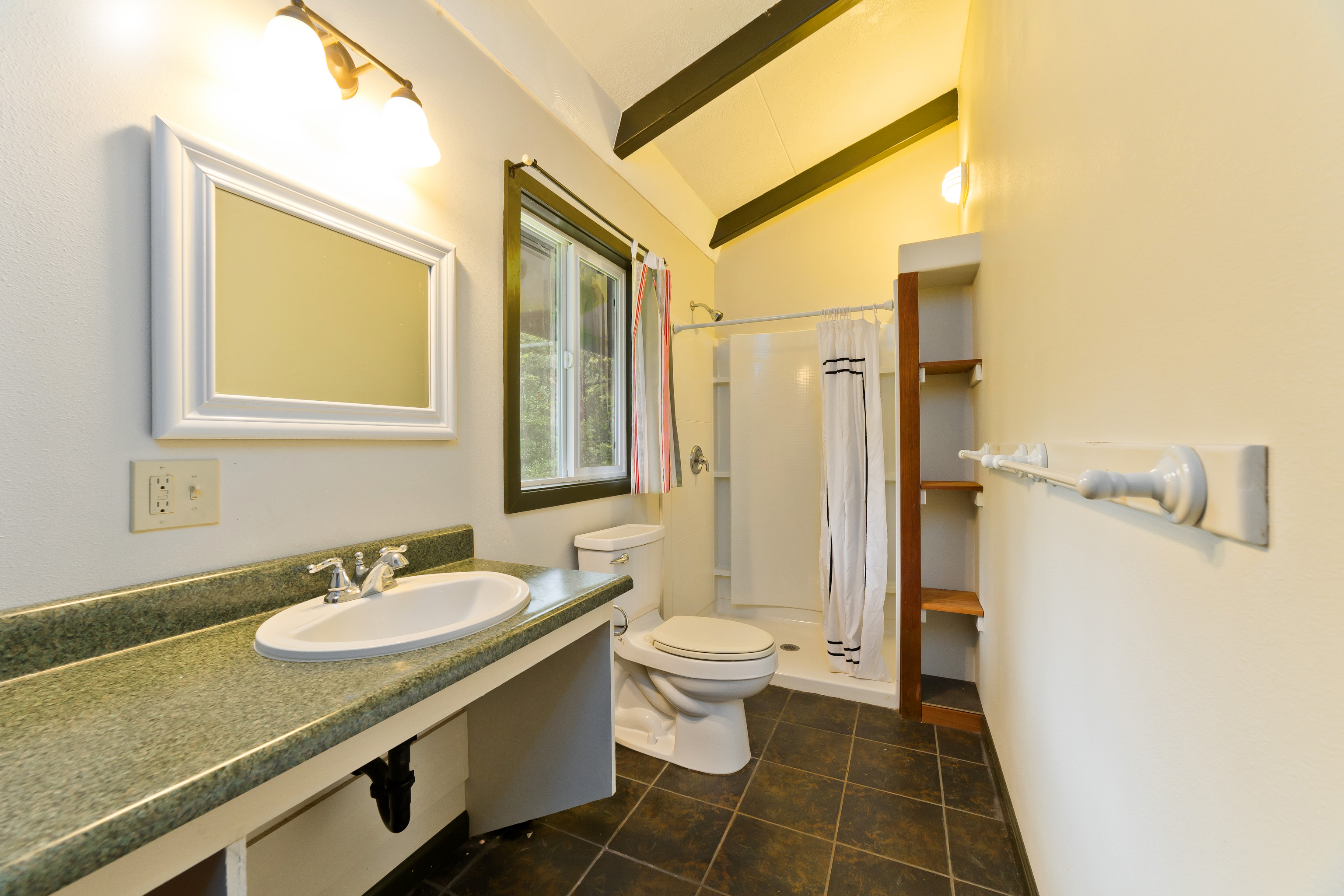 44-3342 Kula Kahiko Road Paauilo, HI 96776 - Photo 20 of 30 a bathroom with a sink a toilet and a mirror
