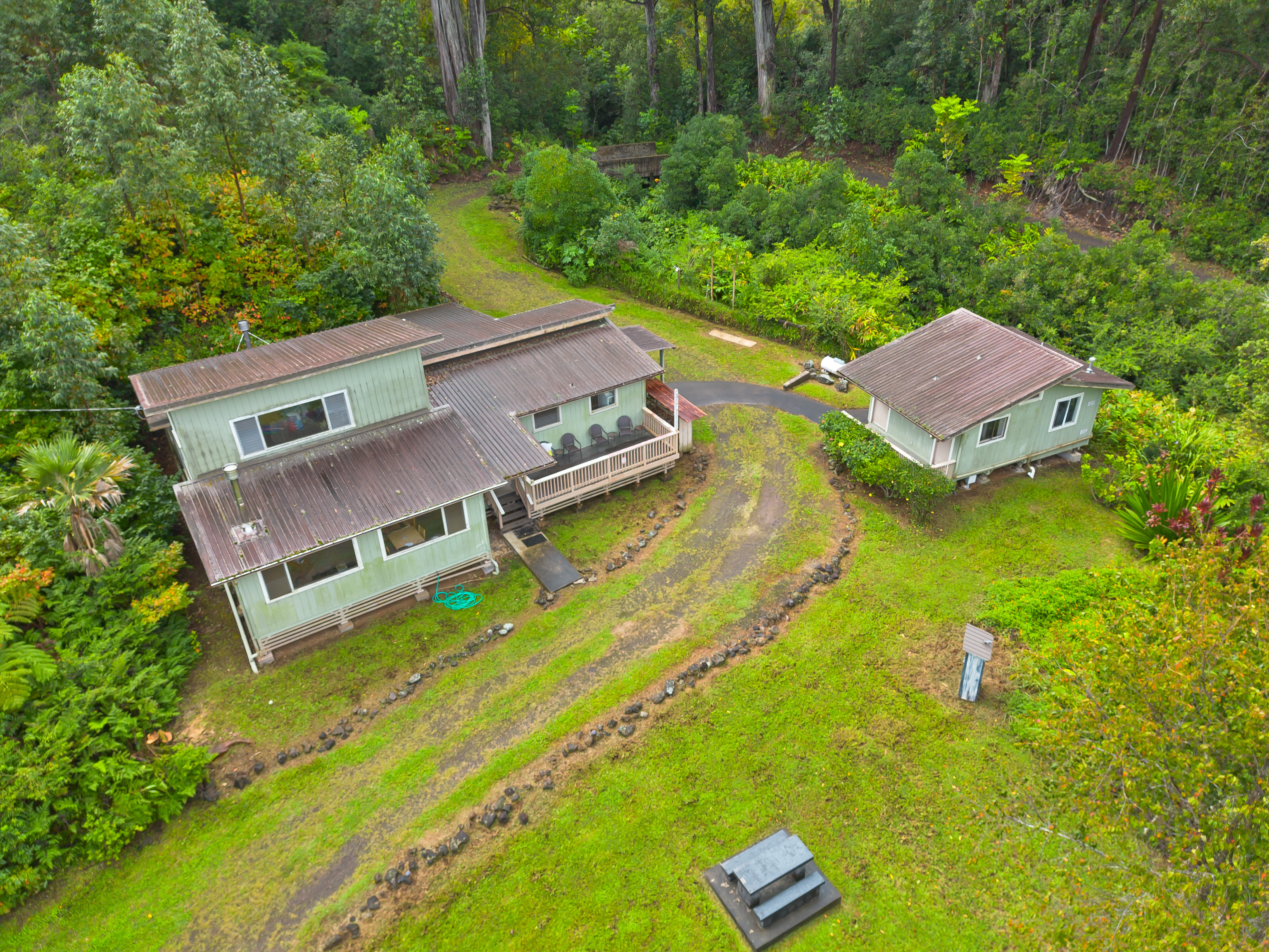 44-3342 Kula Kahiko Road Paauilo, HI 96776 - Photo 2 of 30 an aerial view of a house with a garden and swimming pool