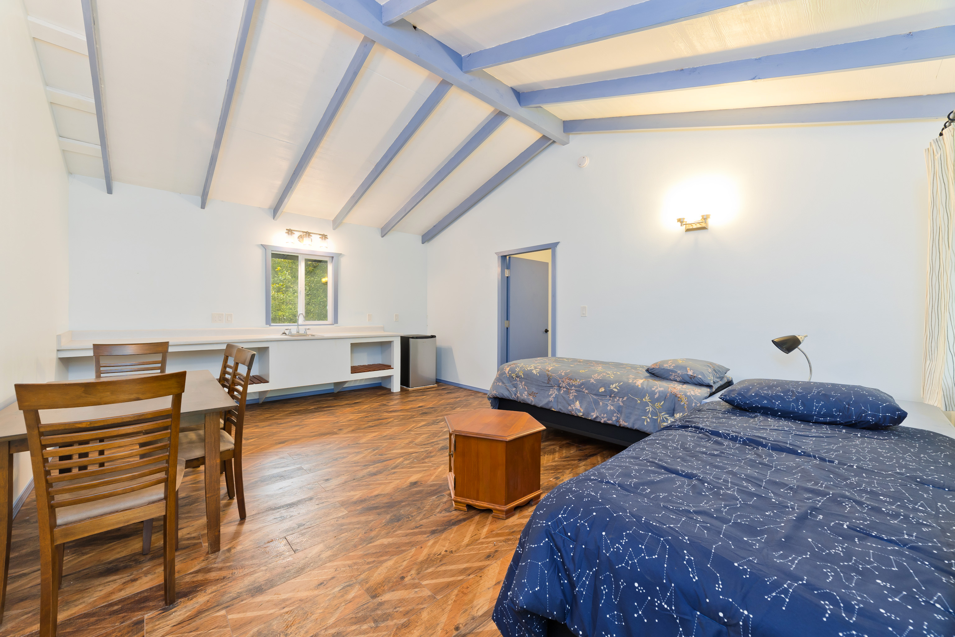 44-3342 Kula Kahiko Road Paauilo, HI 96776 - Photo 21 of 30 a bedroom with furniture and a wooden floor