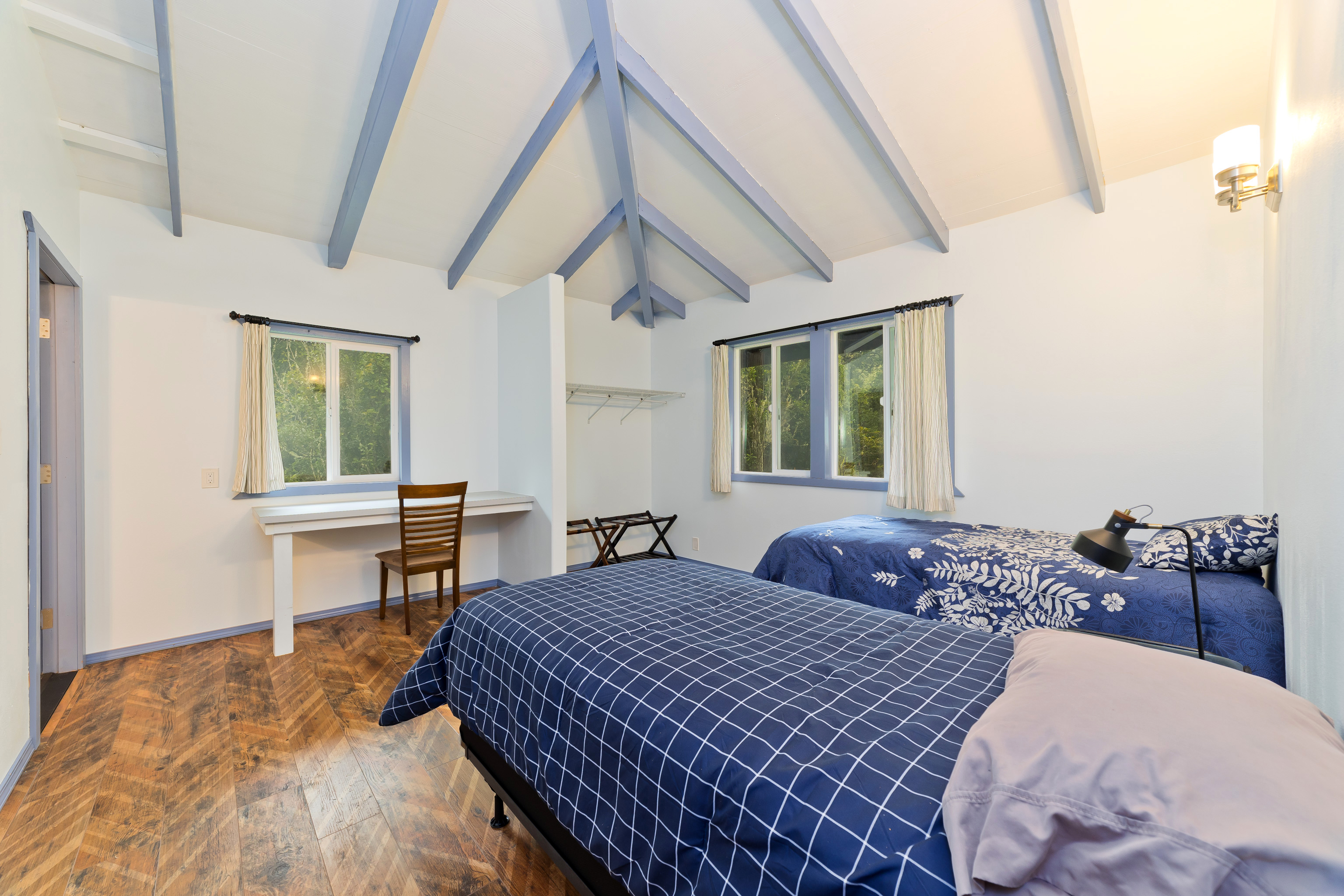 44-3342 Kula Kahiko Road Paauilo, HI 96776 - Photo 22 of 30 a bedroom with a bed and wooden floor