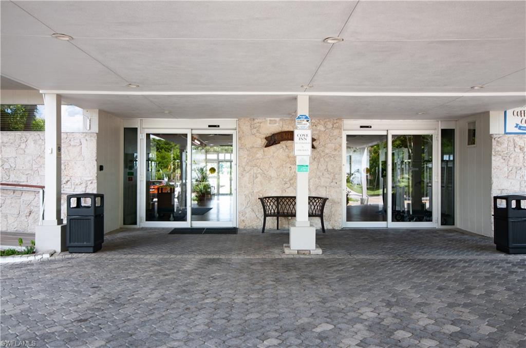 900 Broad Avenue South, Unit 133/134 Naples, FL 34102 - Photo 24 of 37 a view of a chairs in front of house