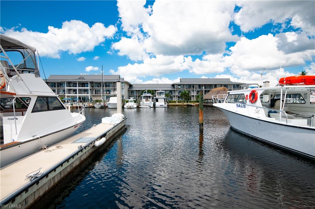900 Broad Avenue South, Unit 133/134 Naples, FL 34102 - Photo 32 of 37 a view of a house with swimming pool and sitting area