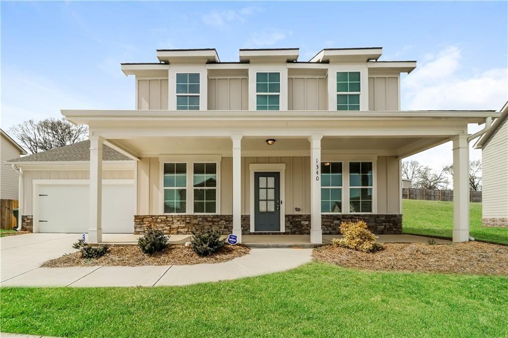 1340 Slaton Manor Drive Conyers, GA 30012 - Photo 1 of 1 a view of a house with backyard porch and garden