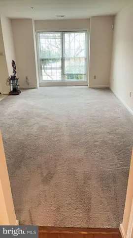 a view of a balcony with wooden floor and fence