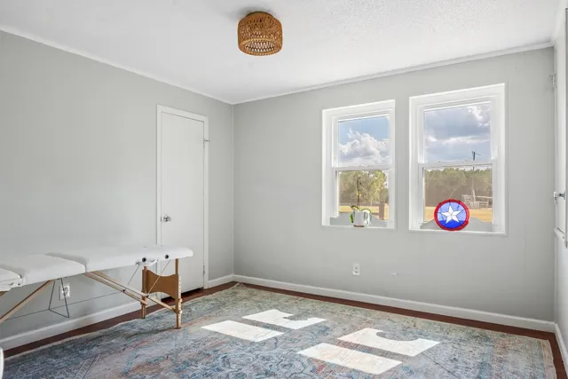 a view of livingroom with furniture and window