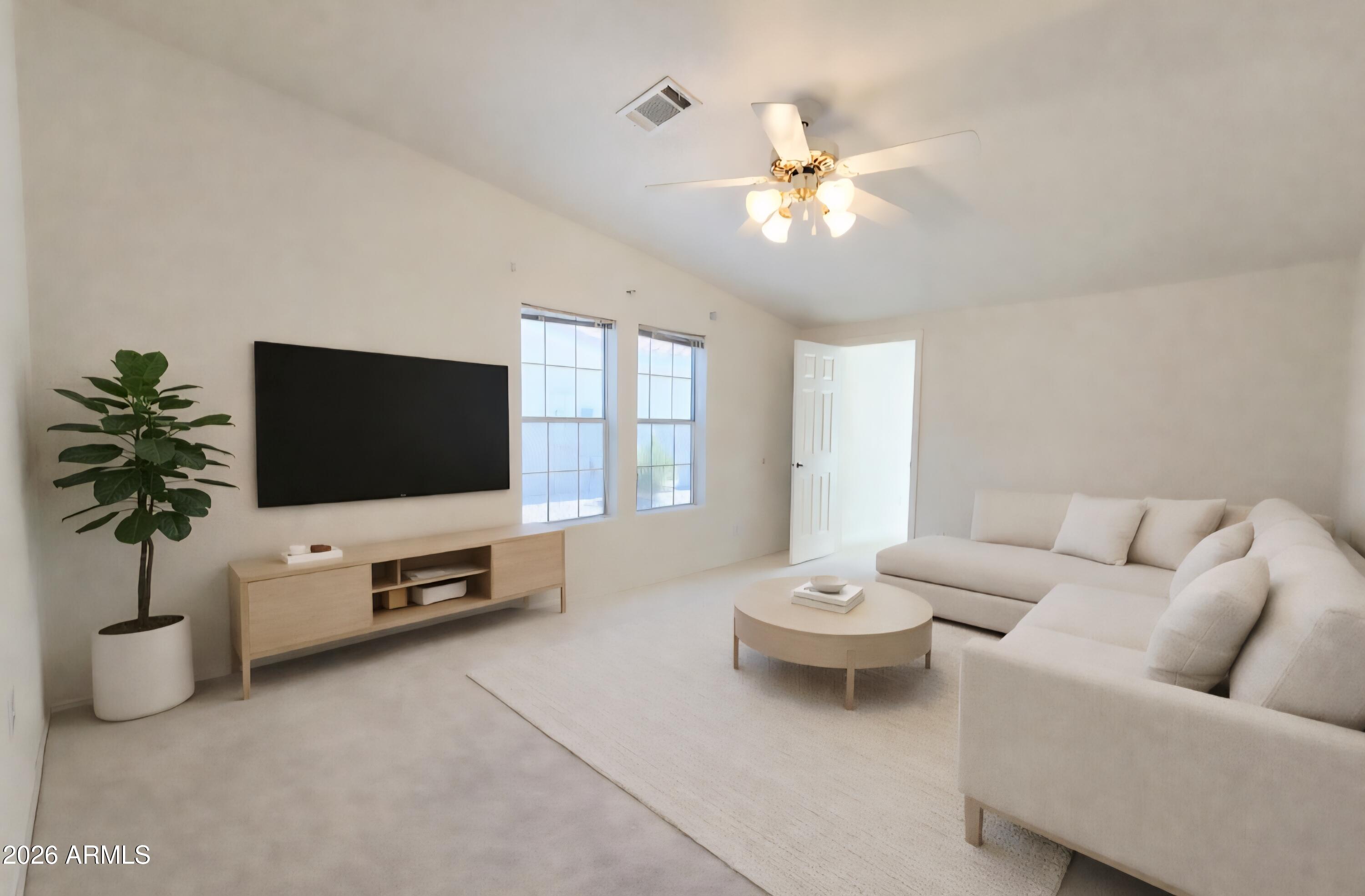3301 South Goldfield Road, Unit 3004 Apache Junction, AZ 85119 - Photo 25 of 67 a living room with furniture a flat screen tv and a window