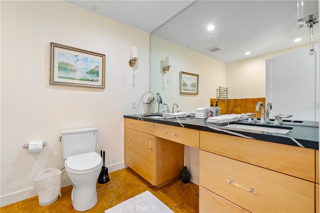 204 18th Street Paso Robles, CA 93446 - Photo 19 of 65 a bathroom with a granite countertop sink and a mirror