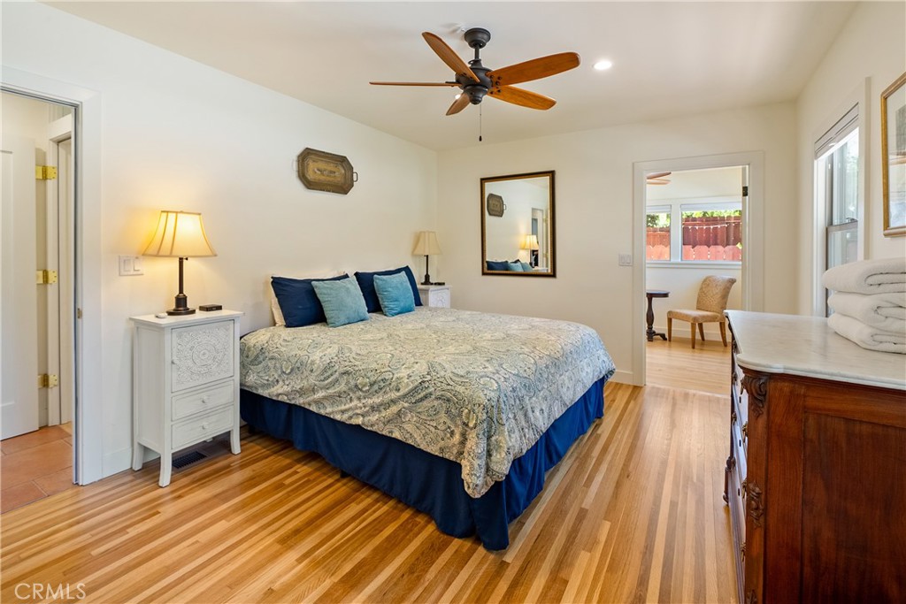 204 18th Street Paso Robles, CA 93446 - Photo 23 of 65 a bedroom with a bed and wooden floor