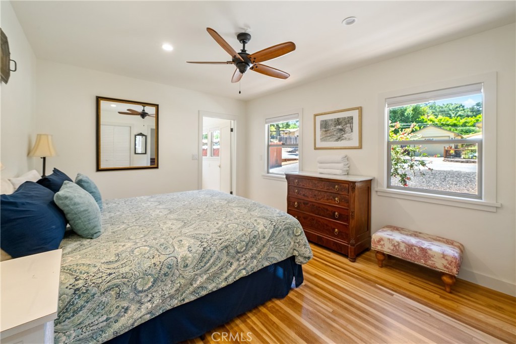 204 18th Street Paso Robles, CA 93446 - Photo 24 of 65 a bedroom with a bed and a dresser next to a window