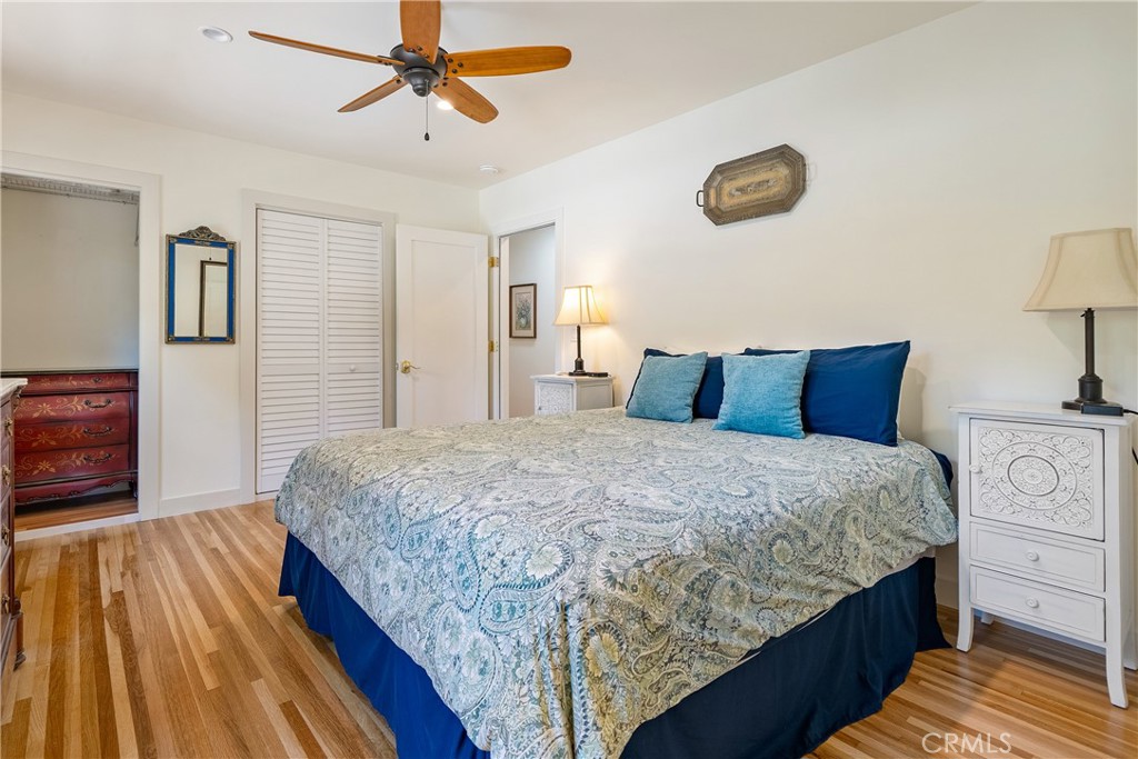 204 18th Street Paso Robles, CA 93446 - Photo 26 of 65 a bedroom with bed and wooden floor