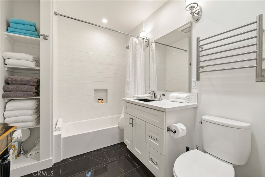 204 18th Street Paso Robles, CA 93446 - Photo 27 of 65 a bathroom with a sink a toilet and shower