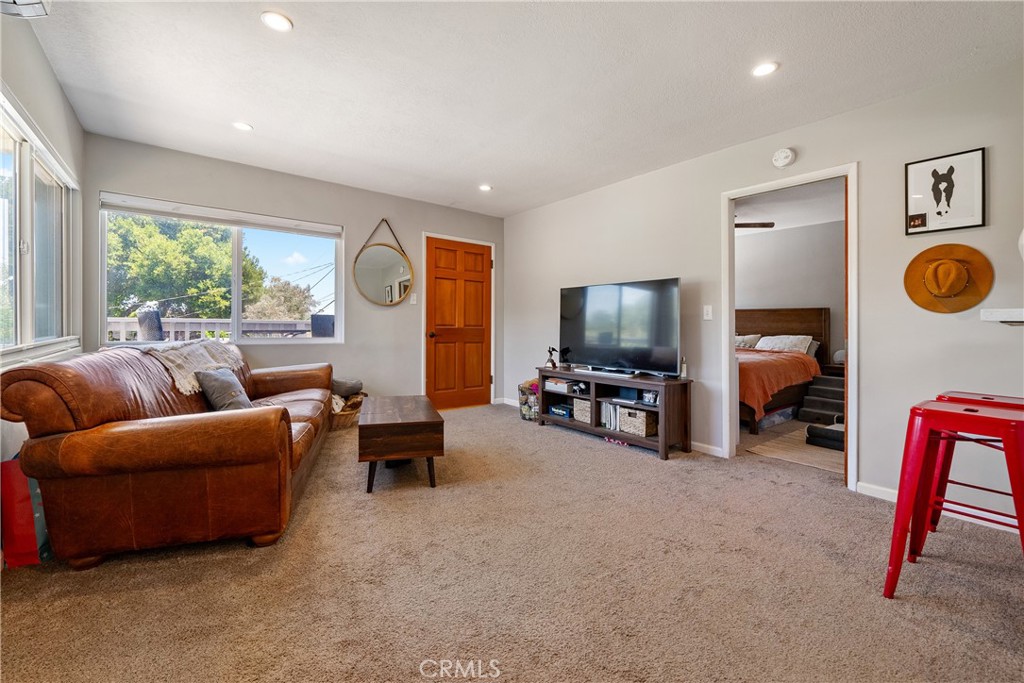 204 18th Street Paso Robles, CA 93446 - Photo 42 of 65 a living room with furniture and a flat screen tv