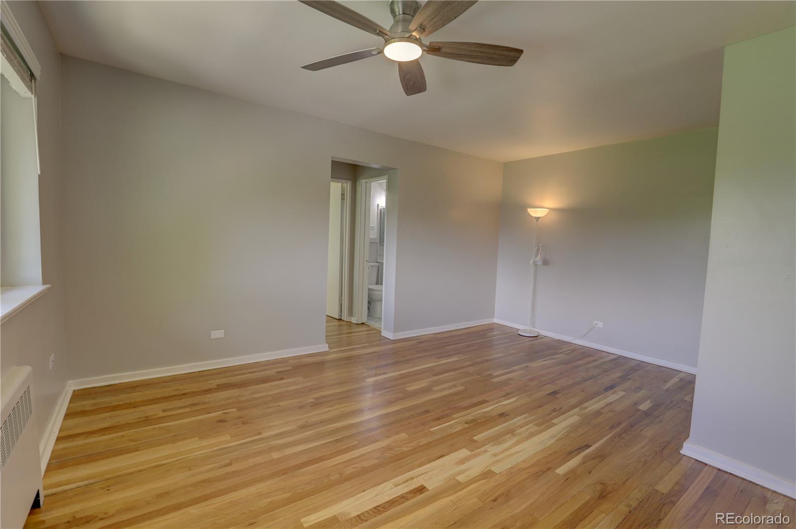 2100 Franklin Street, Unit 8 Denver, CO 80205 - Photo 13 of 29 a view of an empty room and chandelier fan
