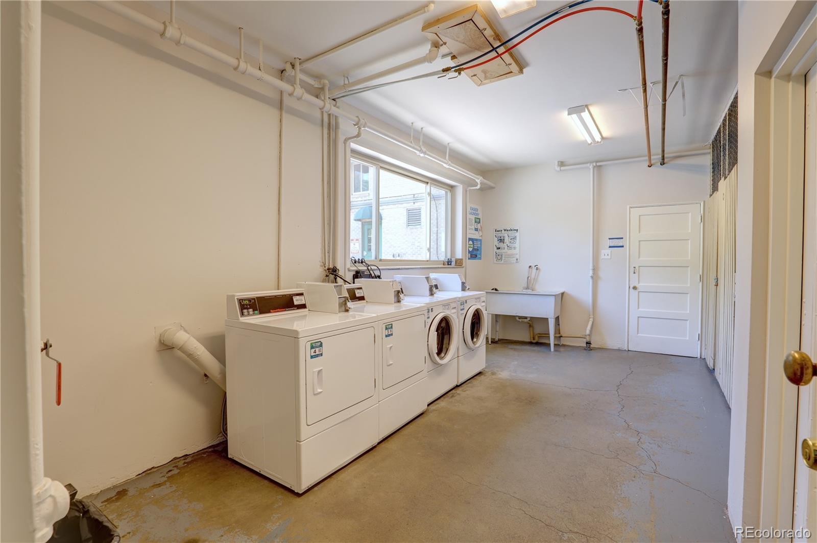 2100 Franklin Street, Unit 8 Denver, CO 80205 - Photo 19 of 29 a view of utility room with washer and dryer