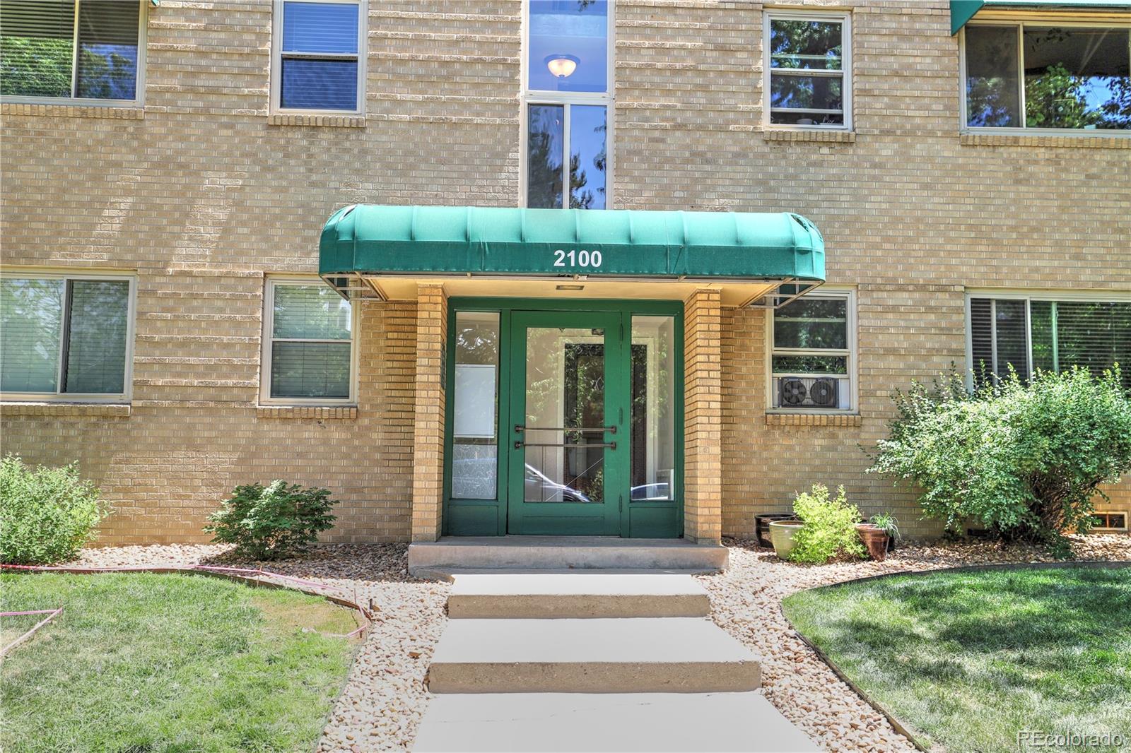 2100 Franklin Street, Unit 8 Denver, CO 80205 - Photo 2 of 29 a front view of a house with garden