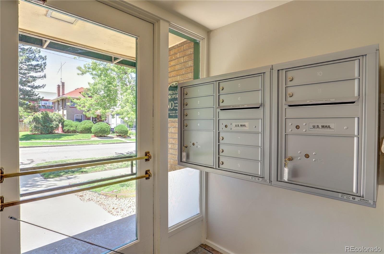 2100 Franklin Street, Unit 8 Denver, CO 80205 - Photo 3 of 29 a view of walk in closet with clothes and window
