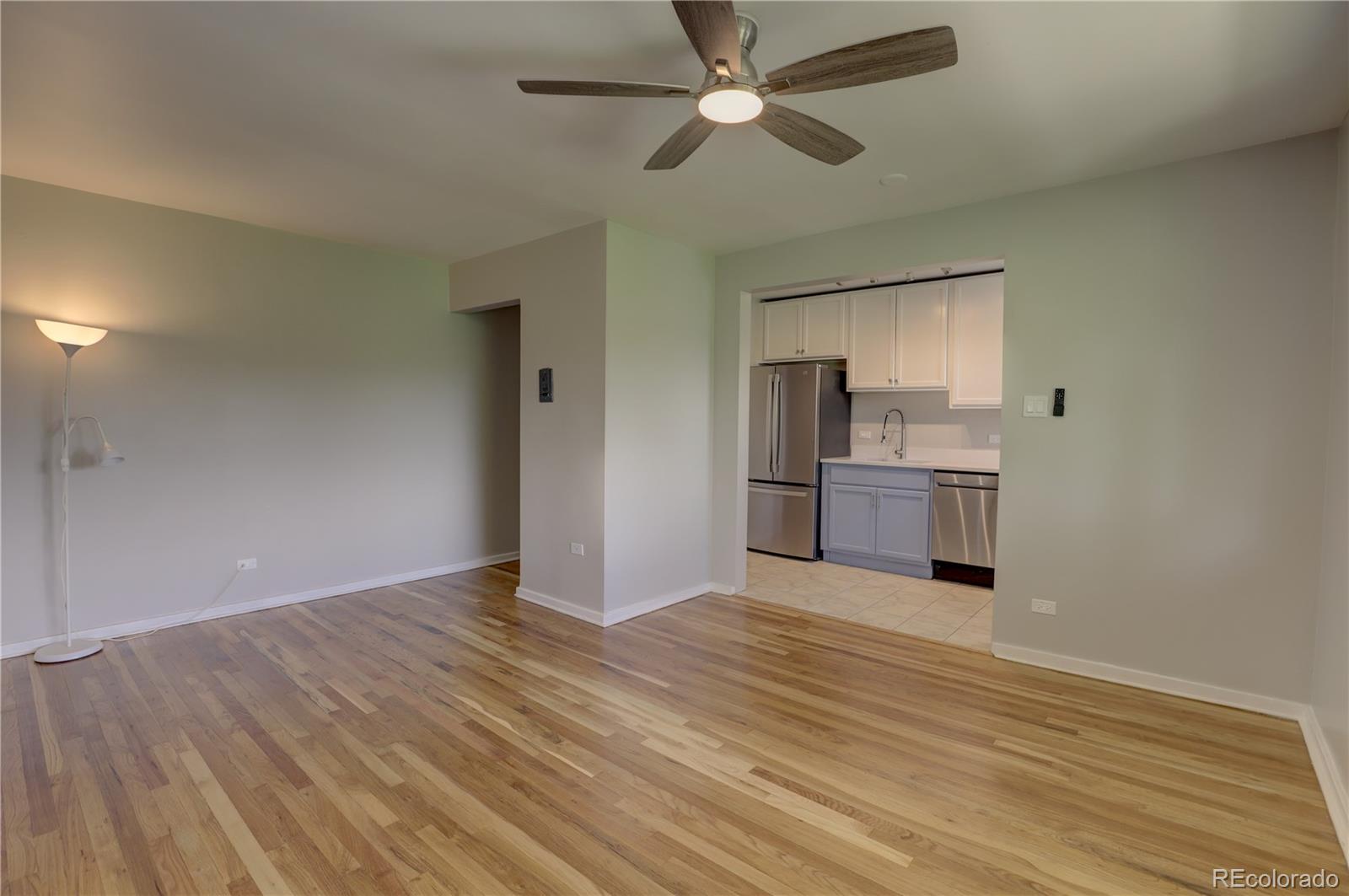 2100 Franklin Street, Unit 8 Denver, CO 80205 - Photo 7 of 29 a view of kitchen with wooden floor electronic appliances and window