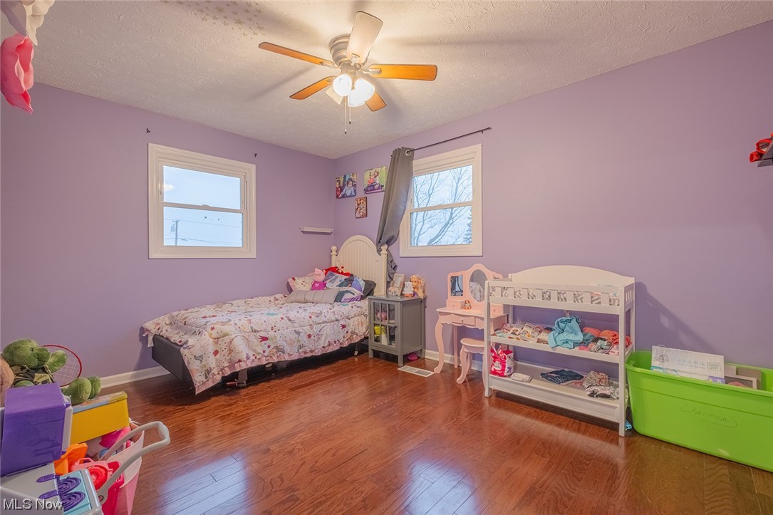 4179 Blake Road Seville, OH 44273 - Photo 16 of 29 Bedroom 2 featuring a ceiling fan and engineered hardwood floors