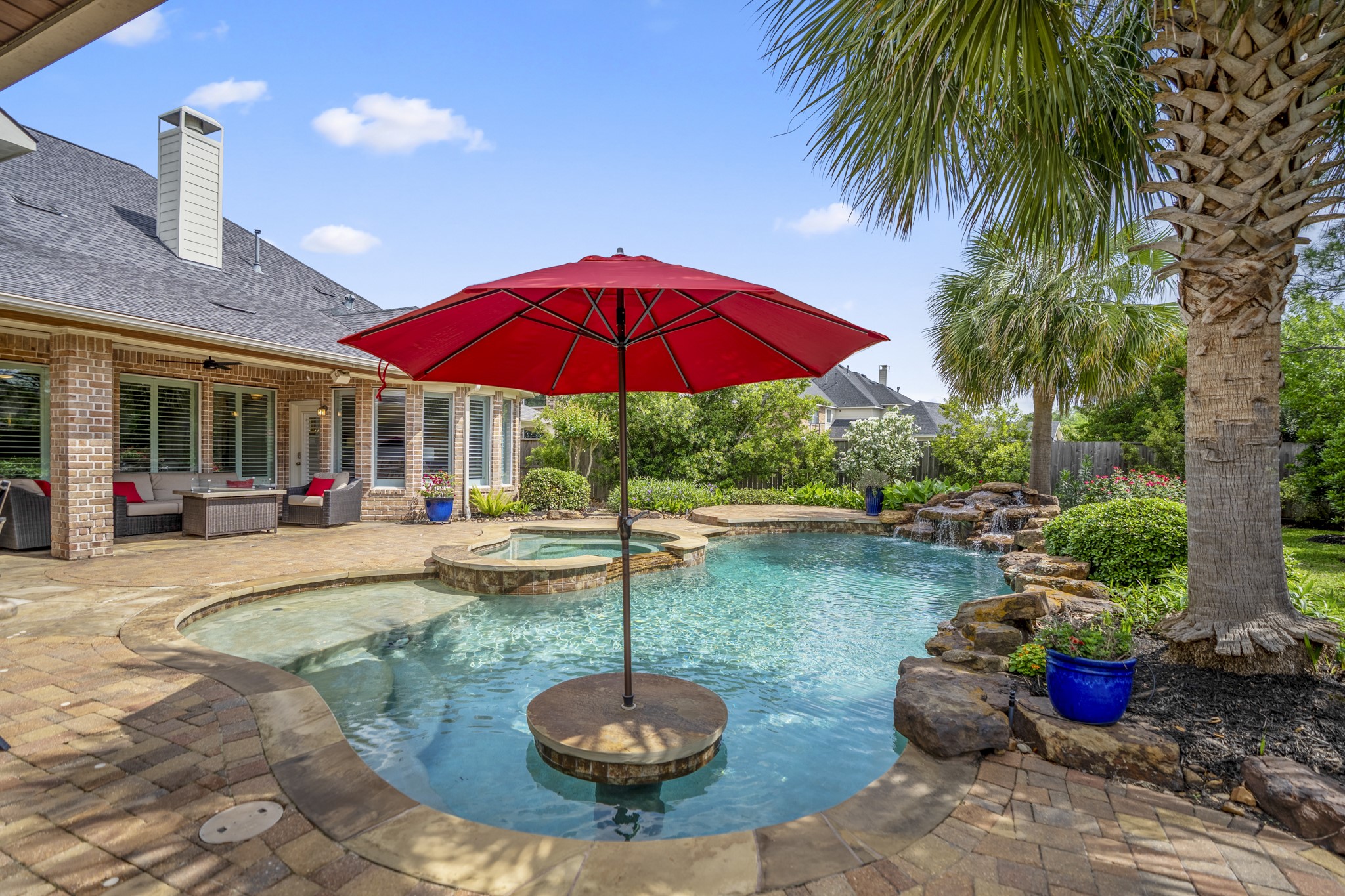 9707 Blue Cruls Way Spring, TX 77379 - Photo 44 of 50 a swimming pool with outdoor seating and yard