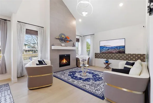 a living room with furniture and a fireplace
