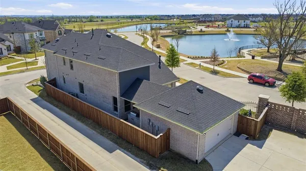an aerial view of a house with a lake view