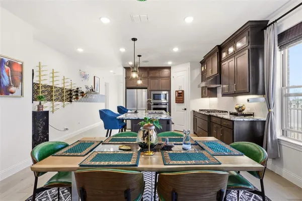 a outdoor dining space with furniture kitchen view and a large window