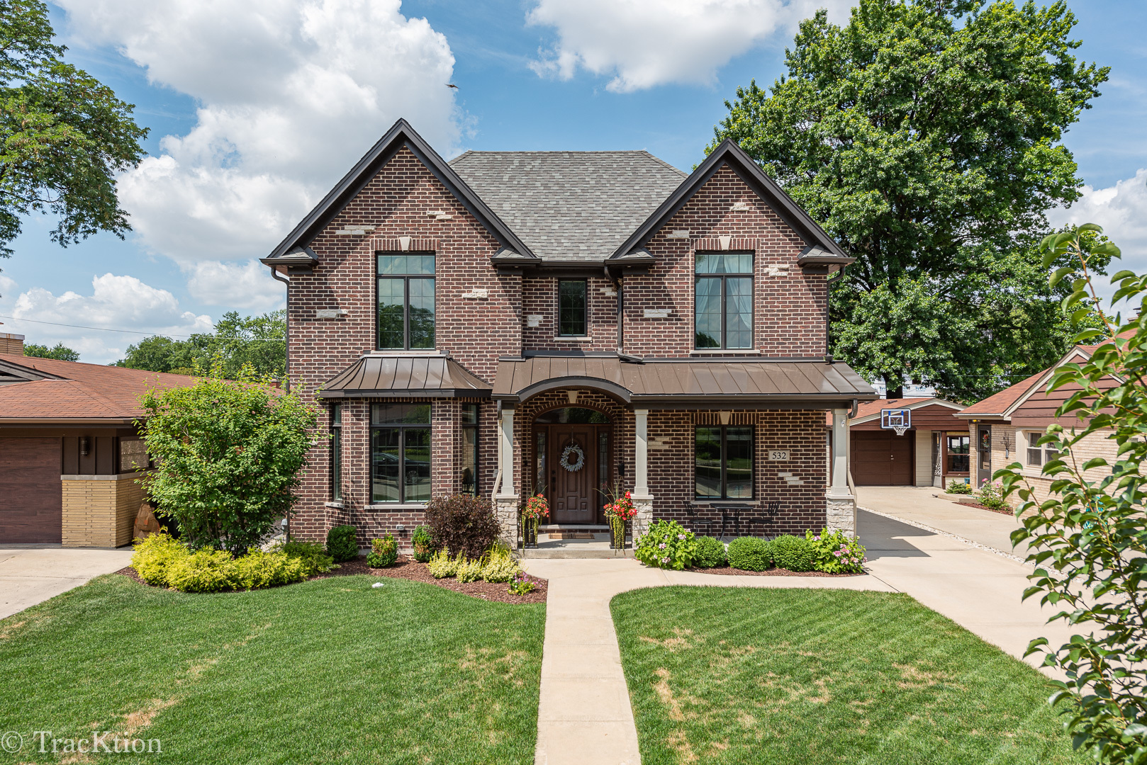 532 North Rose Avenue Park Ridge, IL 60068 - Photo 2 of 48 a front view of a house with a yard and garage