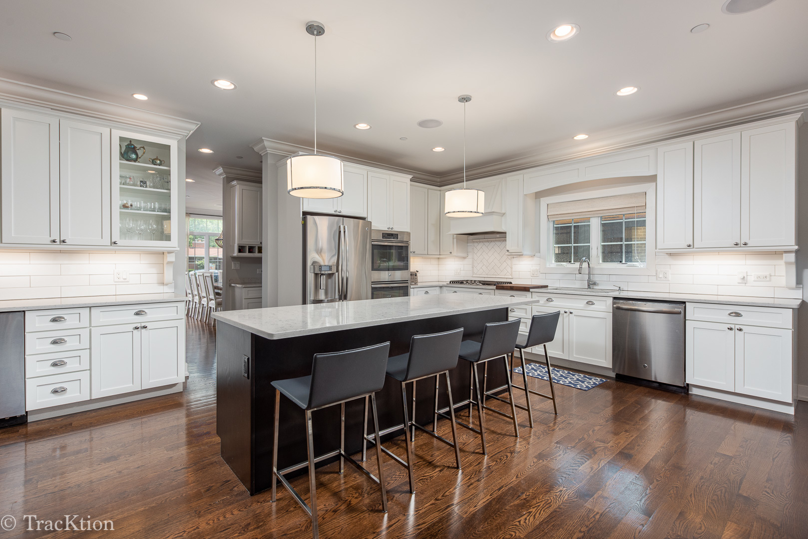532 North Rose Avenue Park Ridge, IL 60068 - Photo 5 of 48 a kitchen with stainless steel appliances granite countertop wooden floor window and cabinets