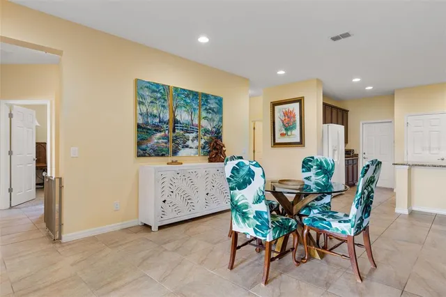 a dining room with furniture and window