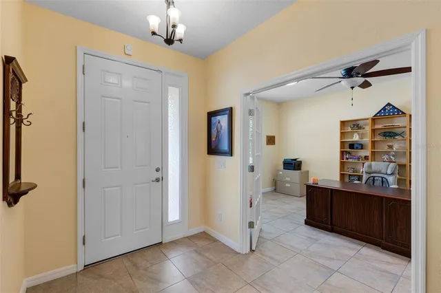 a view of a bedroom with a furniture and a window