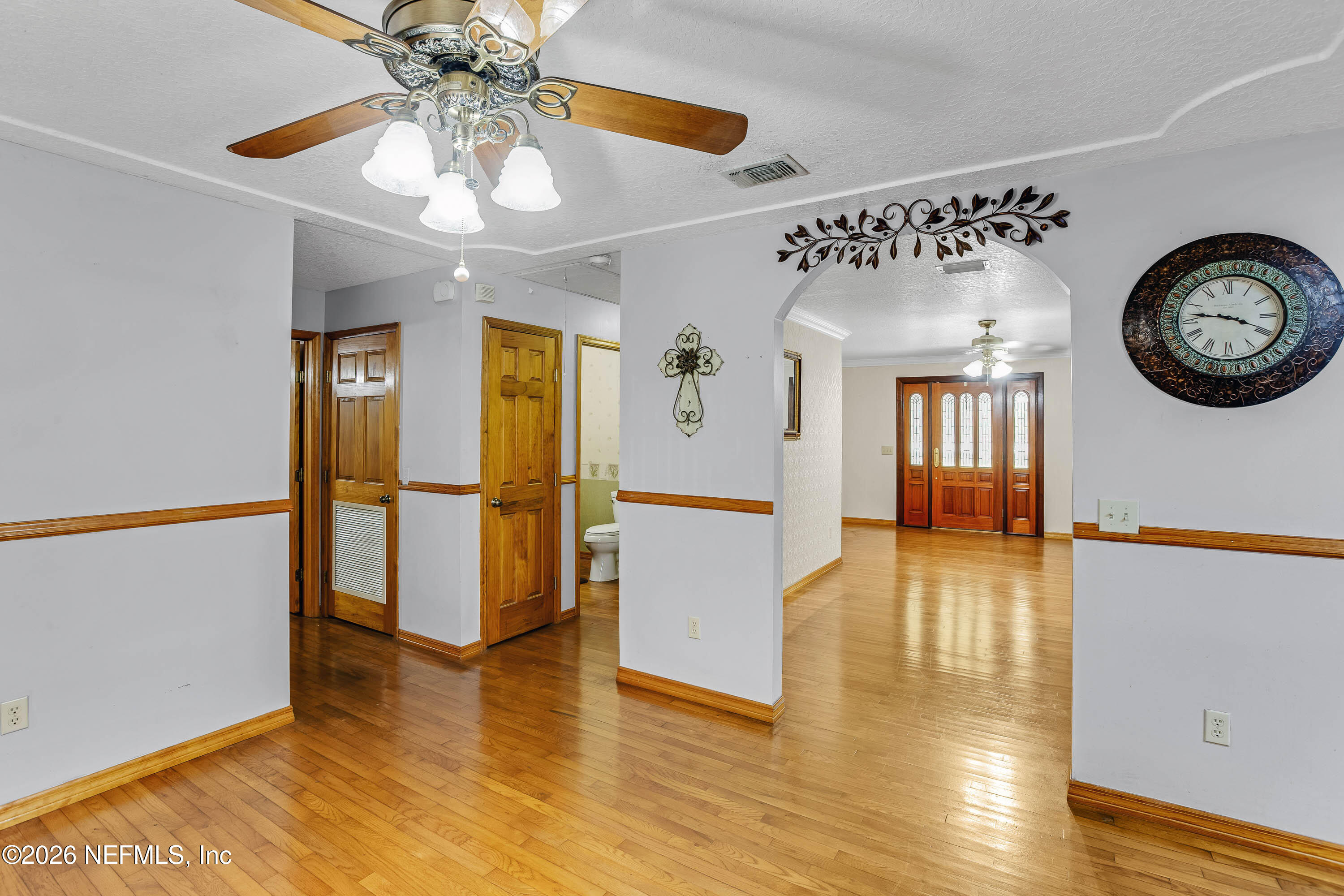 289 Chesser Road Interlachen, FL 32148 - Photo 11 of 63 a view of a hallway with wooden floor