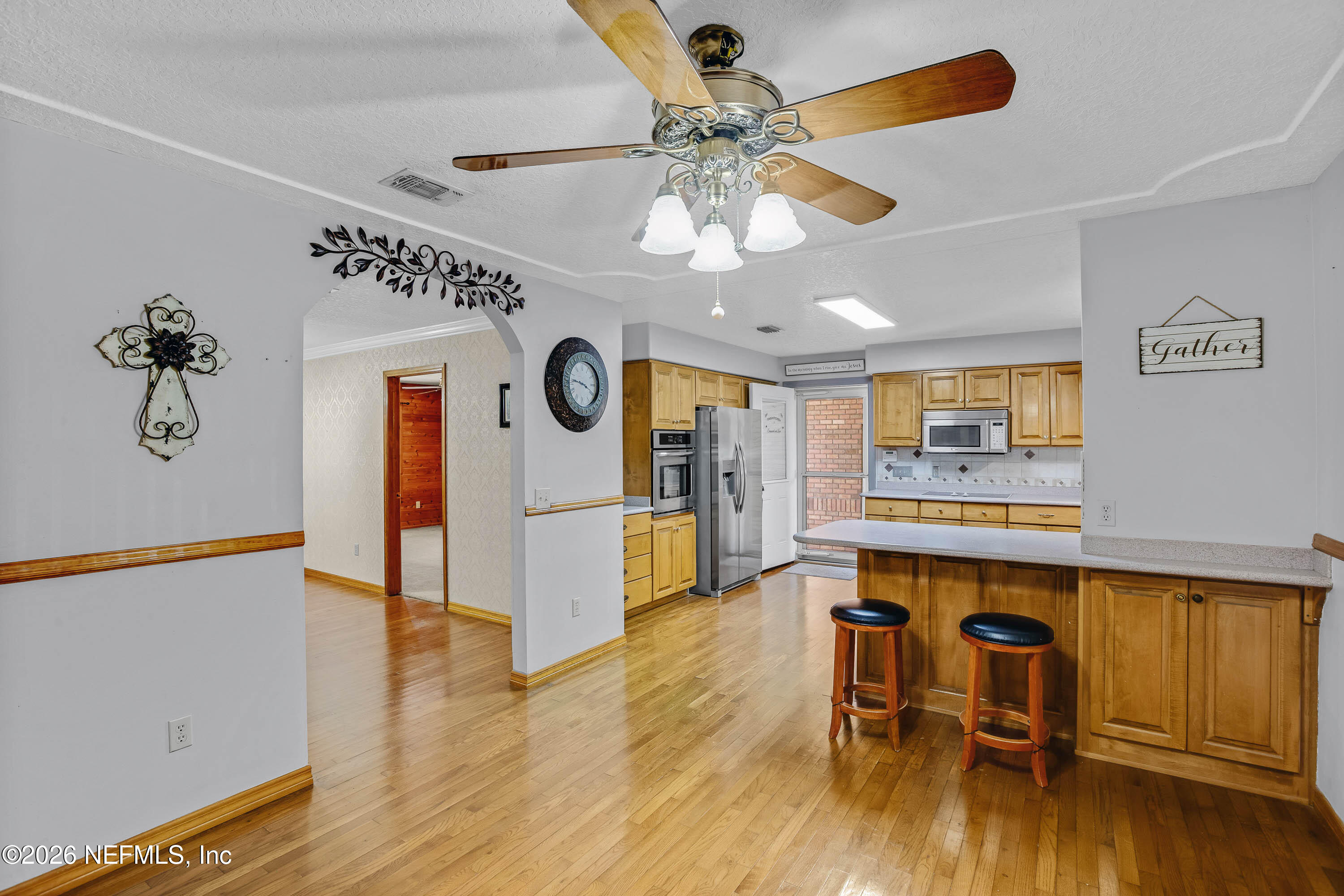 289 Chesser Road Interlachen, FL 32148 - Photo 12 of 63 a view of a room with furniture and wooden floor