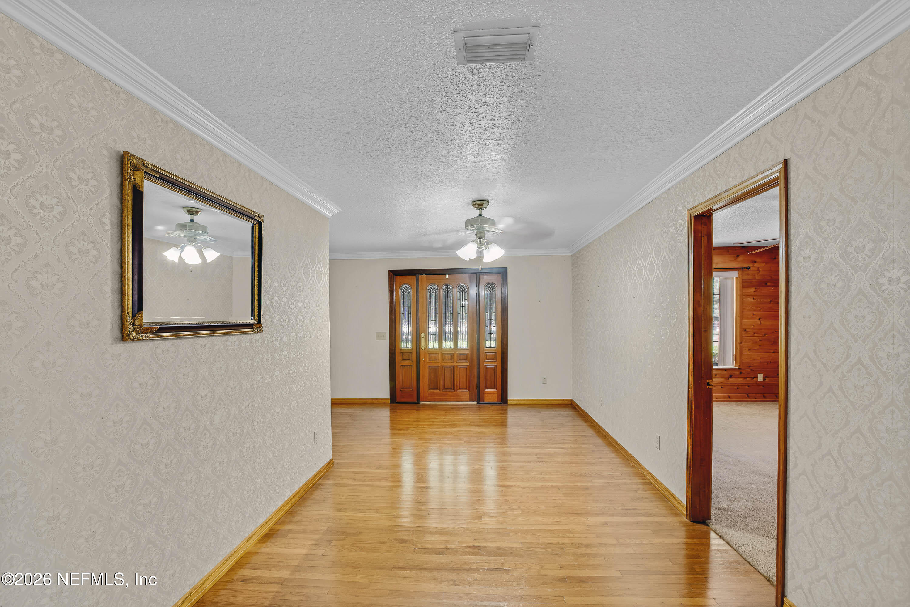289 Chesser Road Interlachen, FL 32148 - Photo 14 of 63 a view of an empty room with glass door