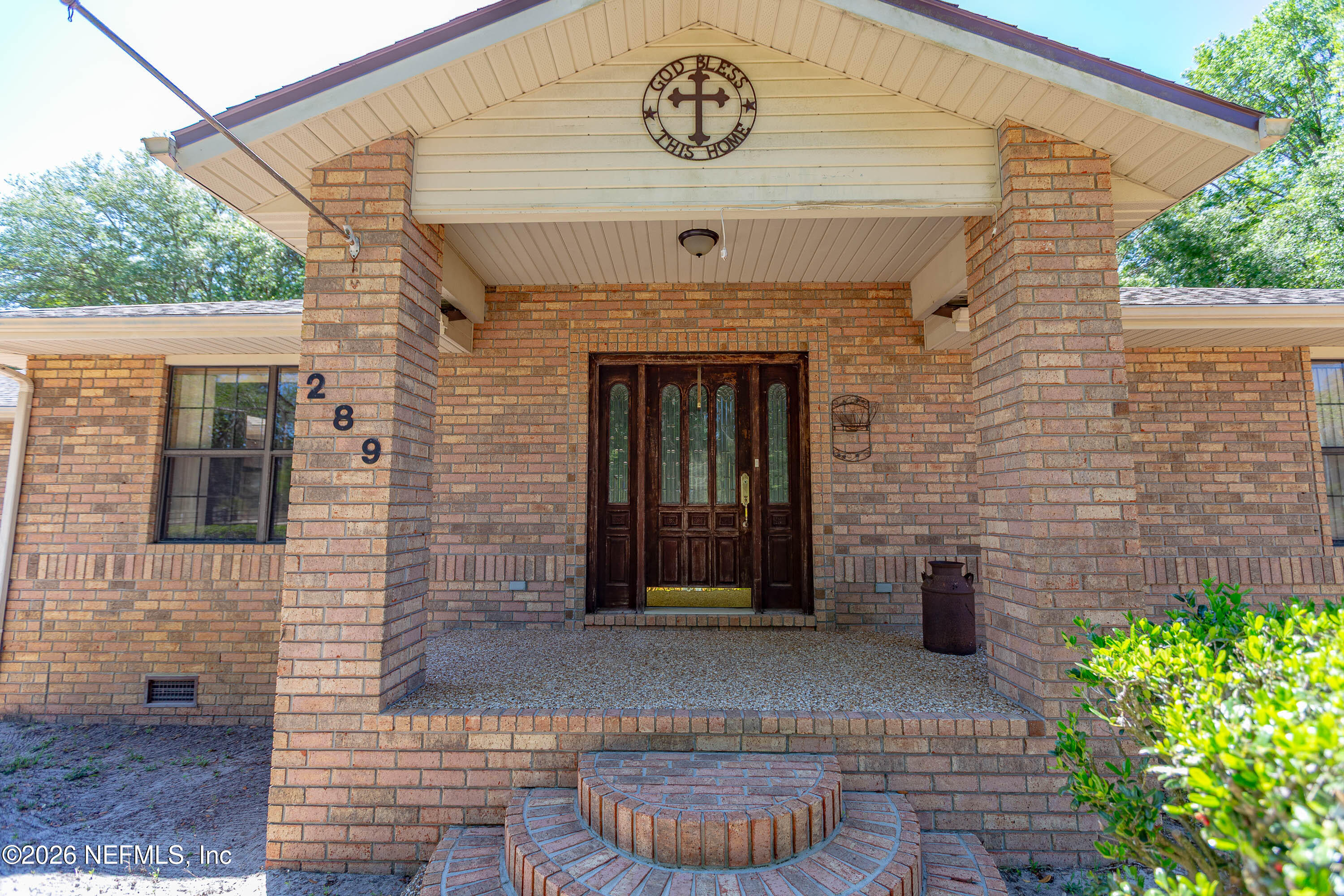 289 Chesser Road Interlachen, FL 32148 - Photo 2 of 63 a front view of a house with garden