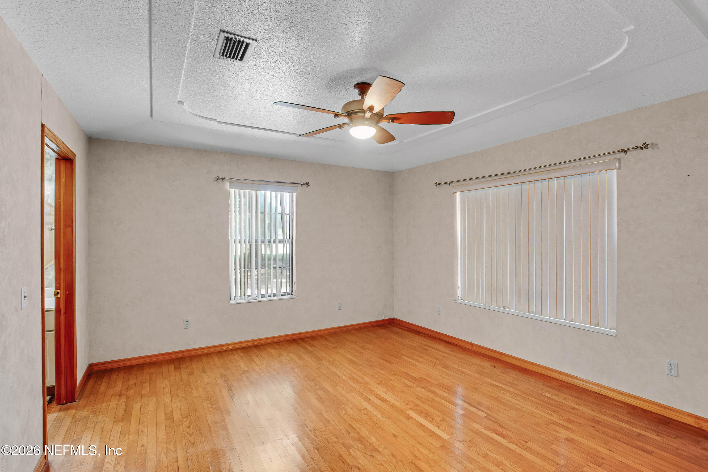 289 Chesser Road Interlachen, FL 32148 - Photo 27 of 63 a view of an empty room with window and chandelier fan