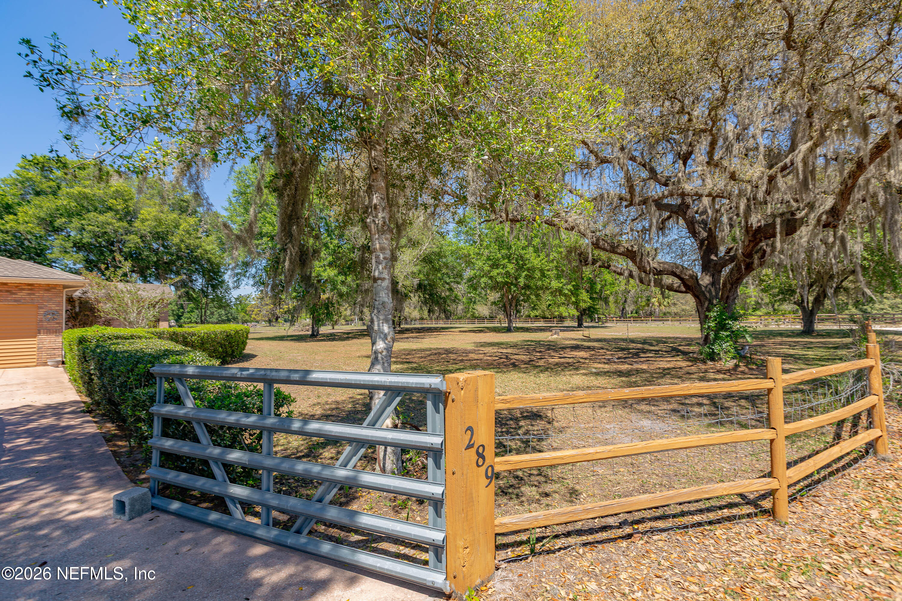 289 Chesser Road Interlachen, FL 32148 - Photo 35 of 63 a view of backyard with deck and outdoor seating
