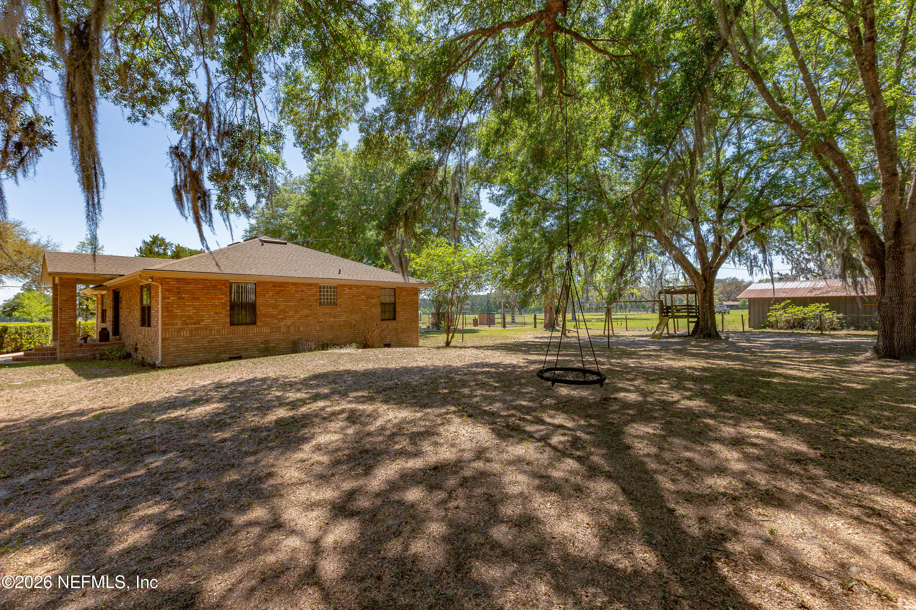 289 Chesser Road Interlachen, FL 32148 - Photo 36 of 63 a front view of a house with a yard
