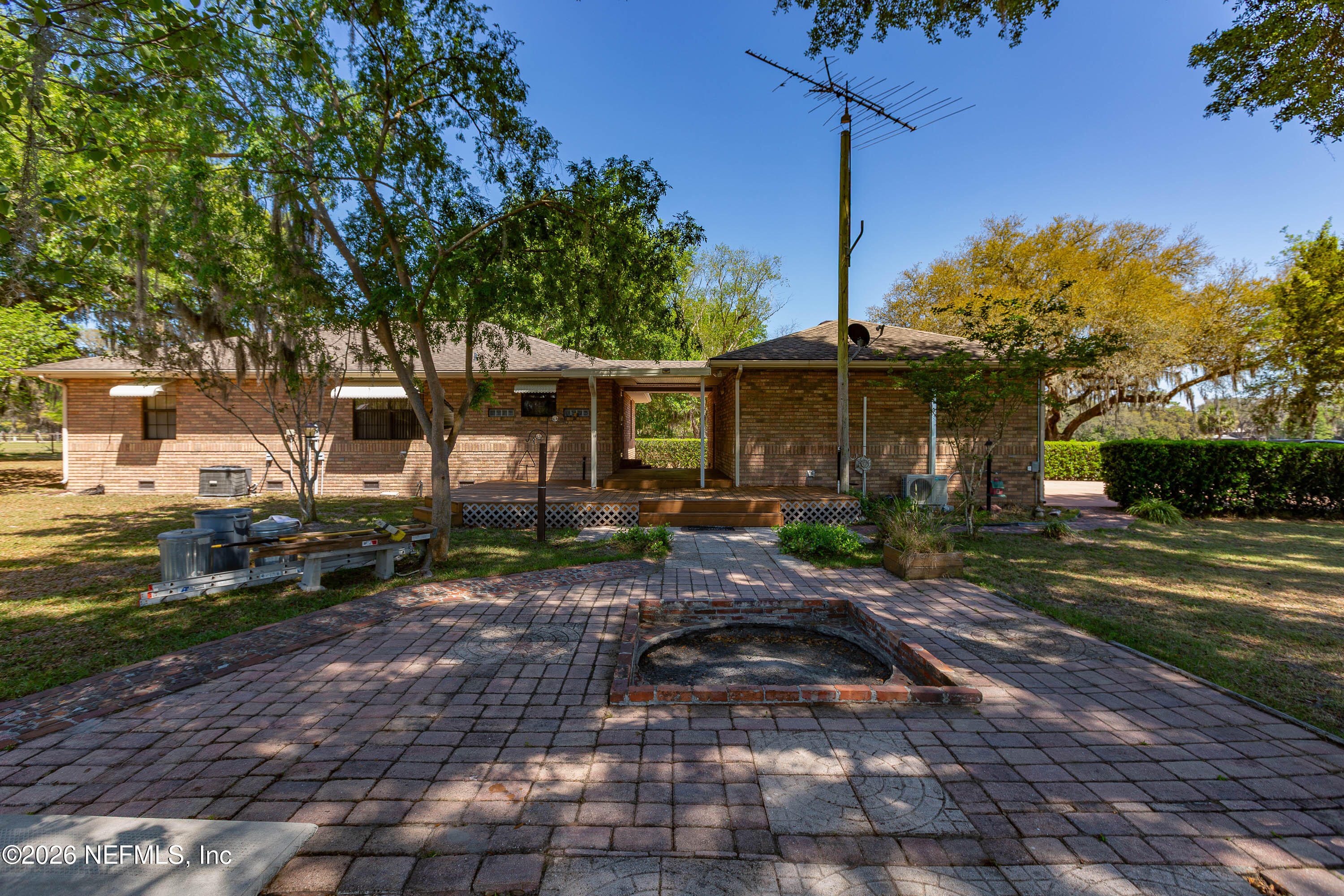 289 Chesser Road Interlachen, FL 32148 - Photo 40 of 63 a front view of a house with a yard