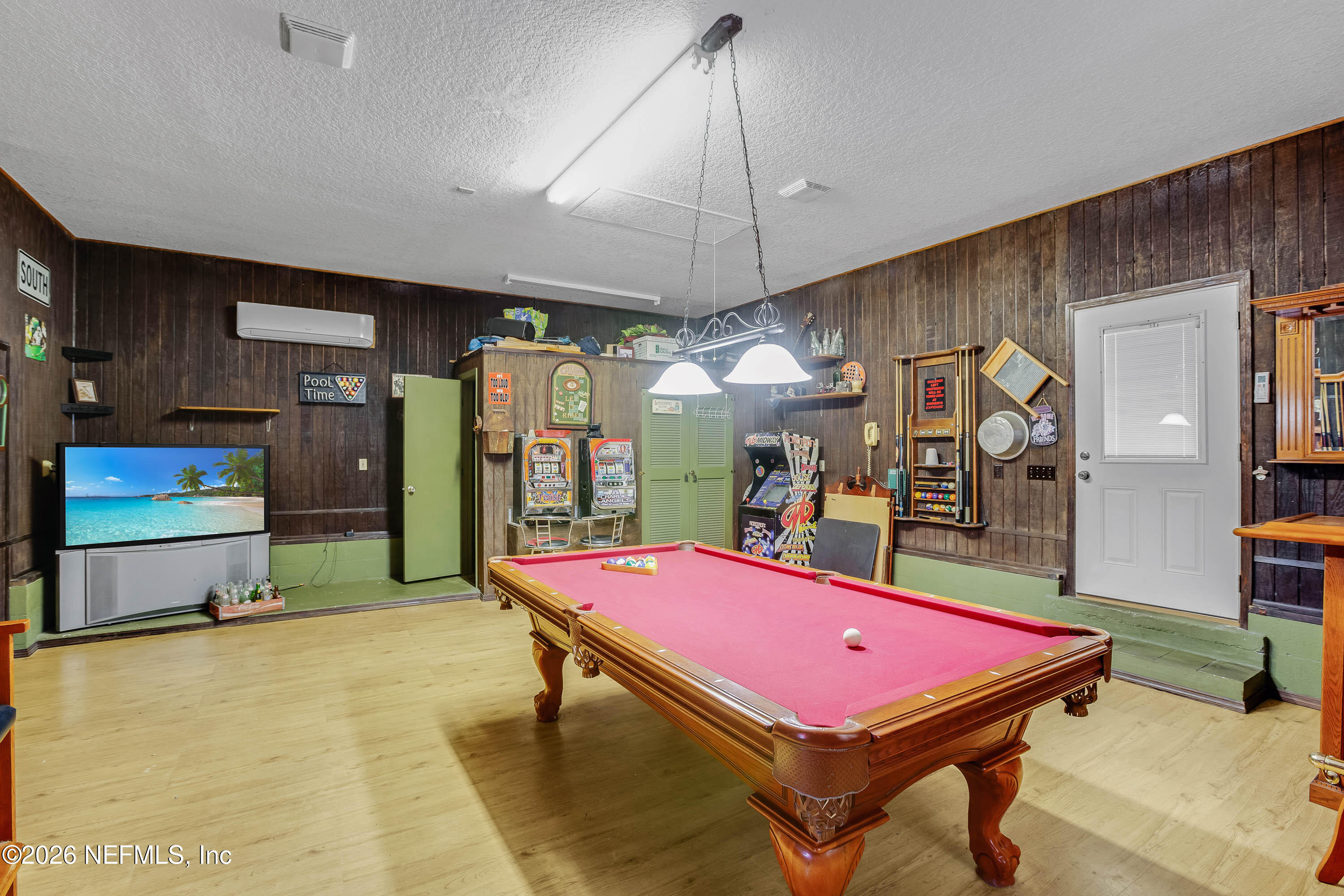 289 Chesser Road Interlachen, FL 32148 - Photo 4 of 63 a room with pool table and a flat screen tv