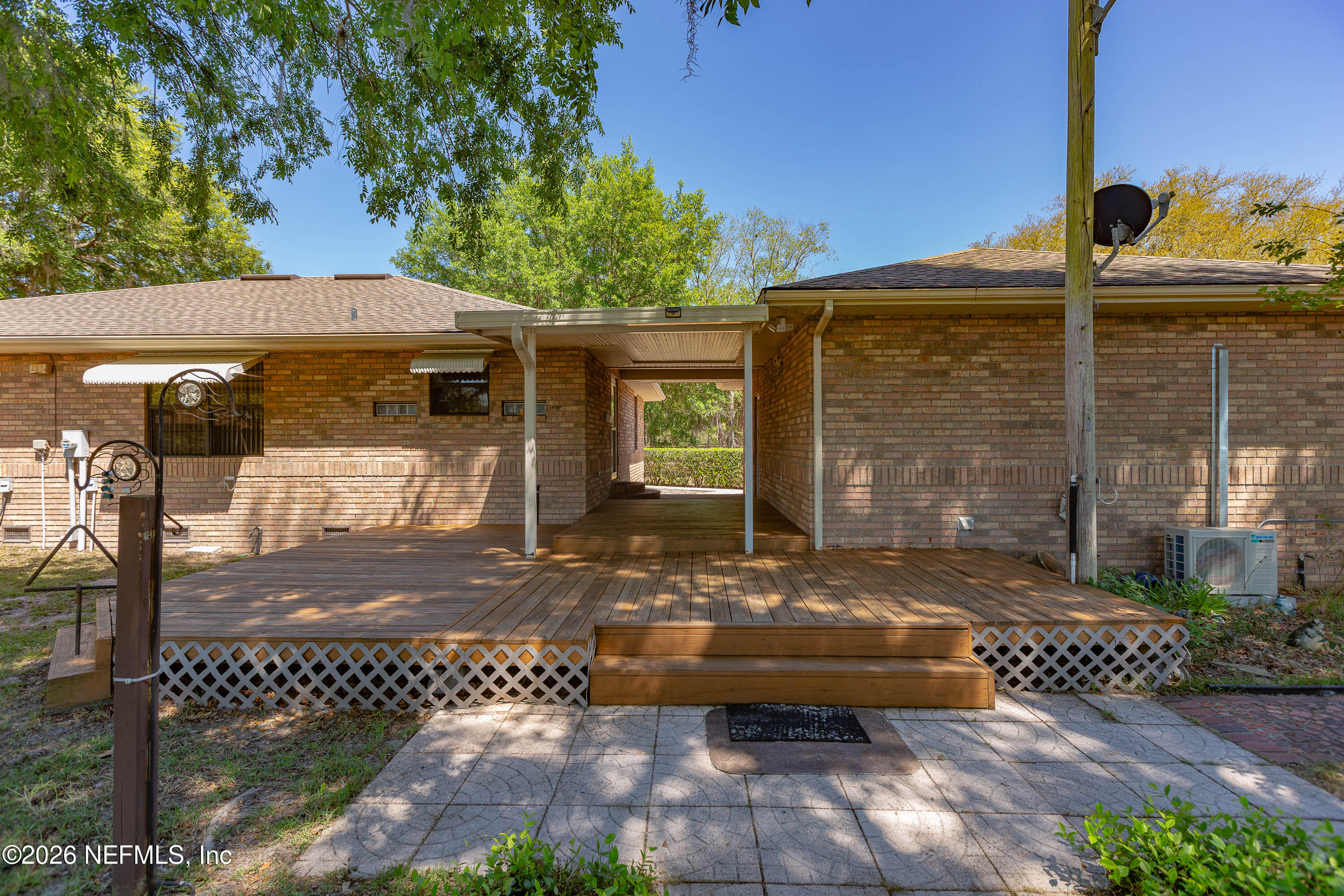 289 Chesser Road Interlachen, FL 32148 - Photo 42 of 63 a view of a patio with table and chairs and potted plants