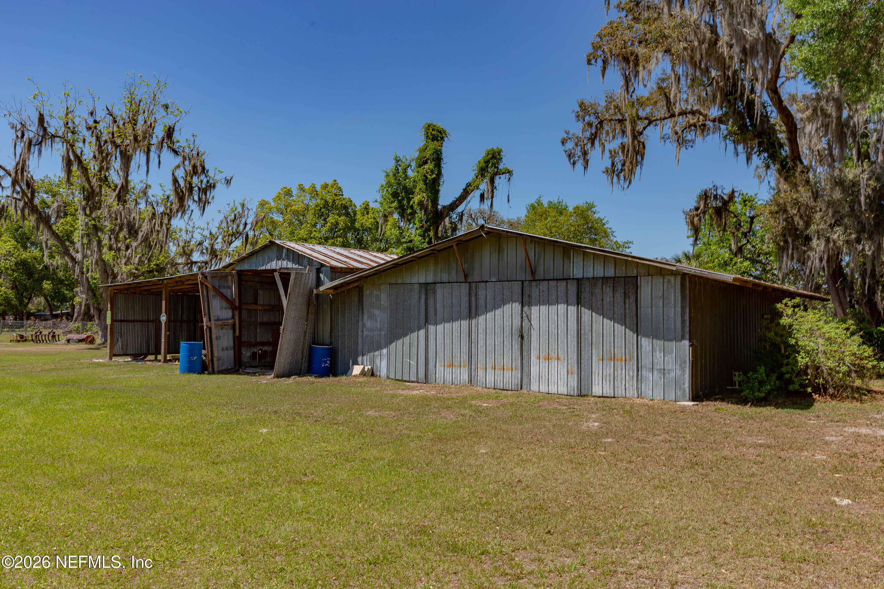 289 Chesser Road Interlachen, FL 32148 - Photo 48 of 63 a view of a house with a yard and potted plants