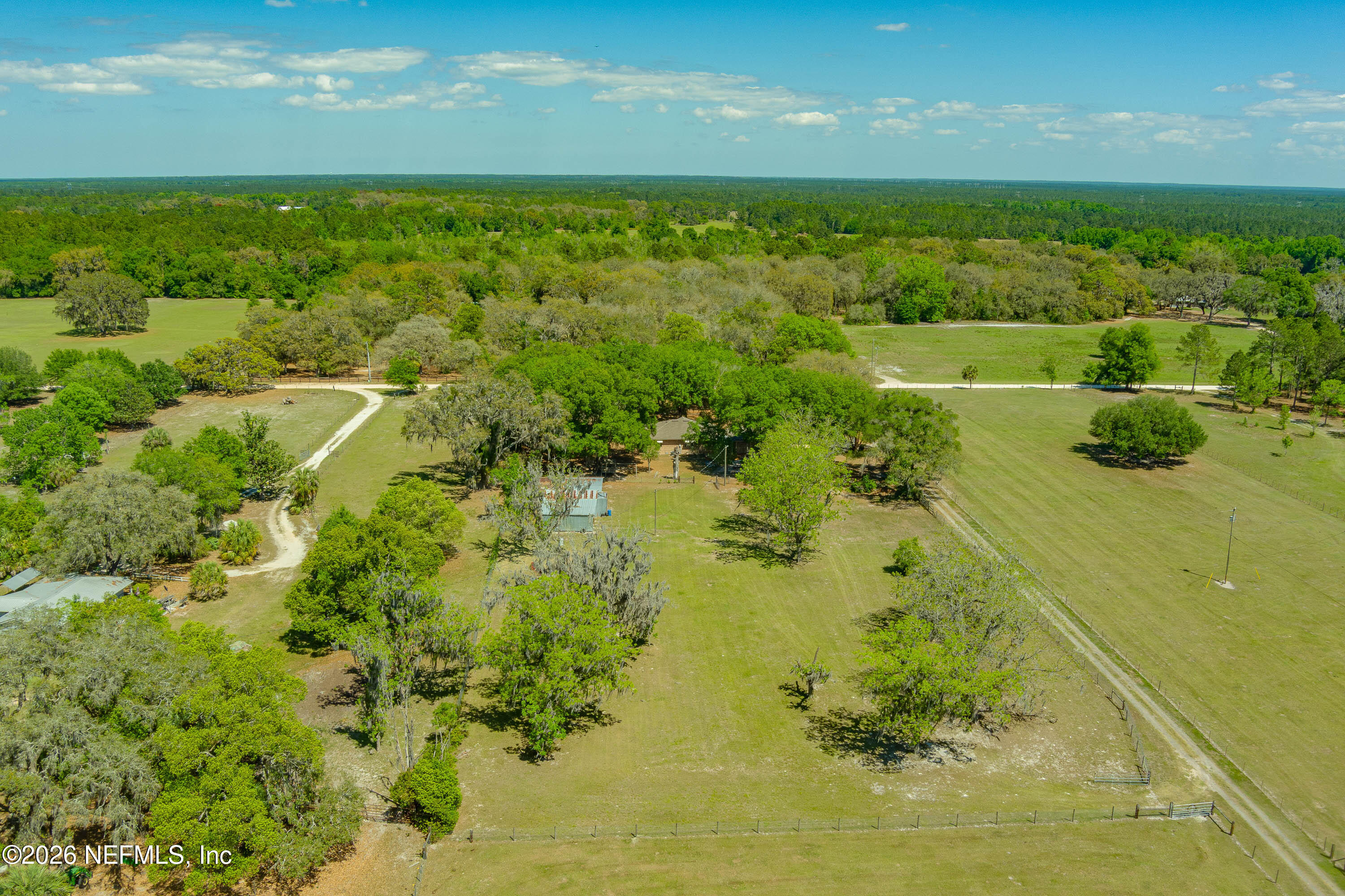 289 Chesser Road Interlachen, FL 32148 - Photo 58 of 63 a view of a lake with a yard