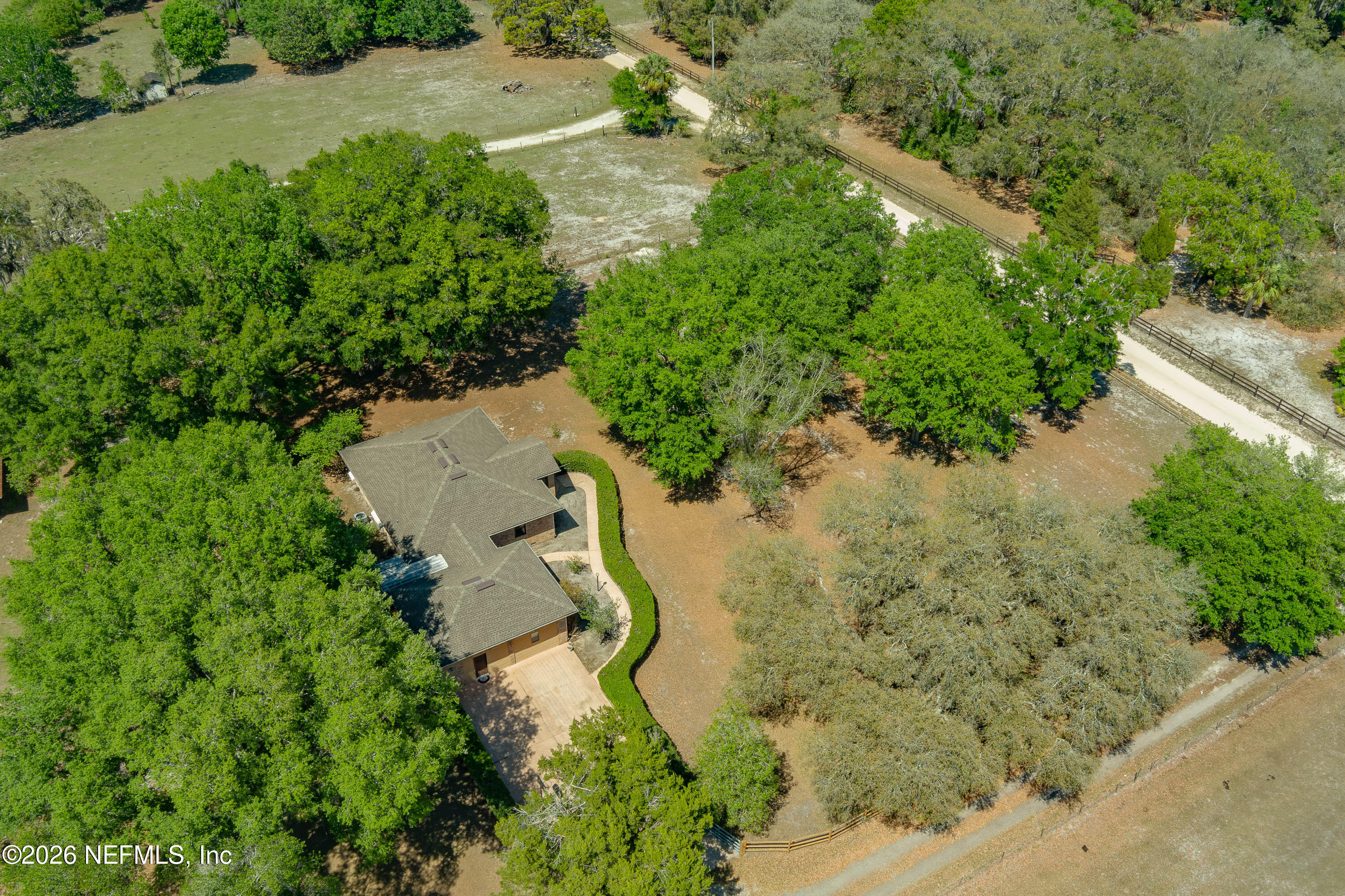 289 Chesser Road Interlachen, FL 32148 - Photo 59 of 63 an aerial view of residential house with outdoor space and trees all around
