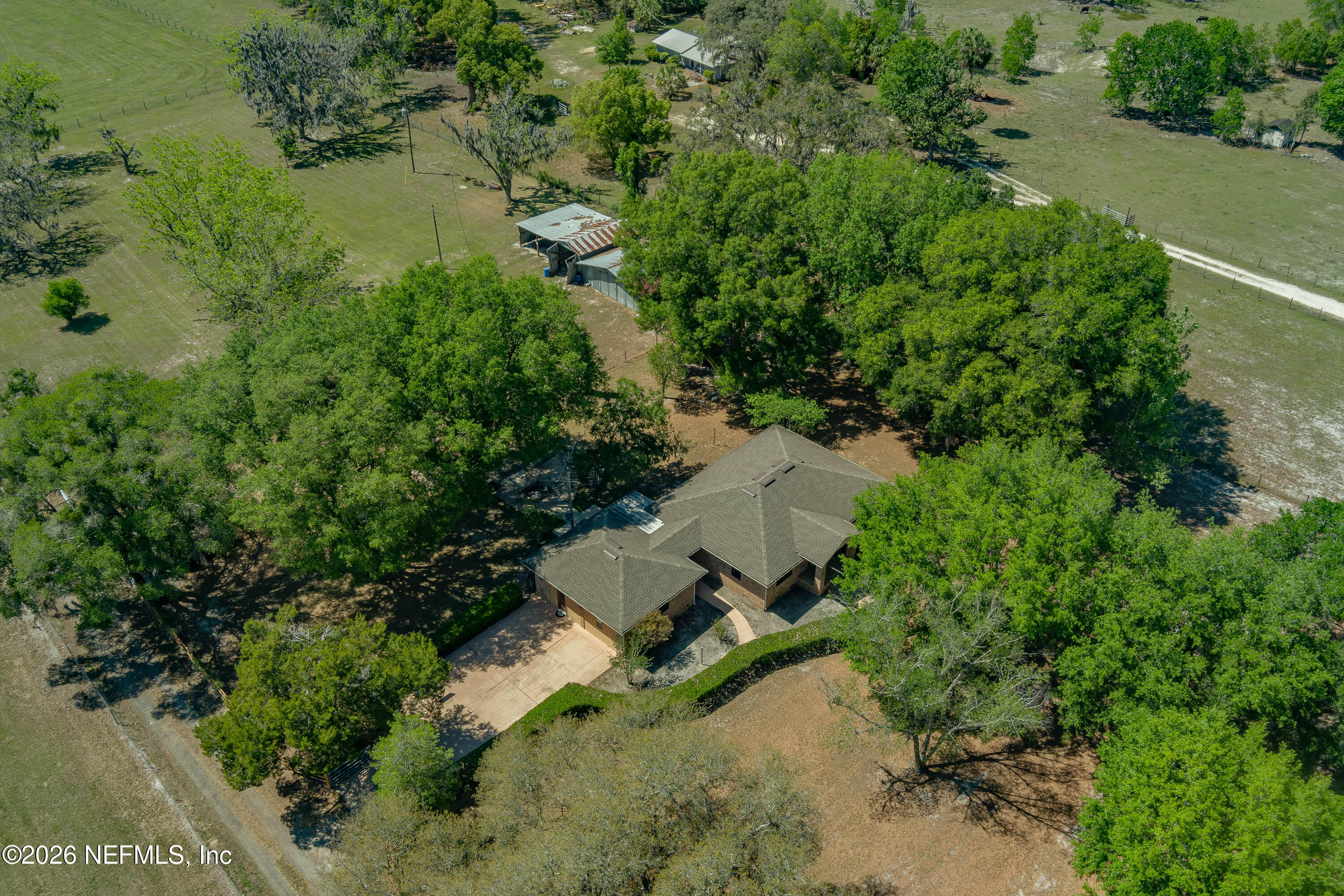 289 Chesser Road Interlachen, FL 32148 - Photo 60 of 63 an aerial view of a house with a yard