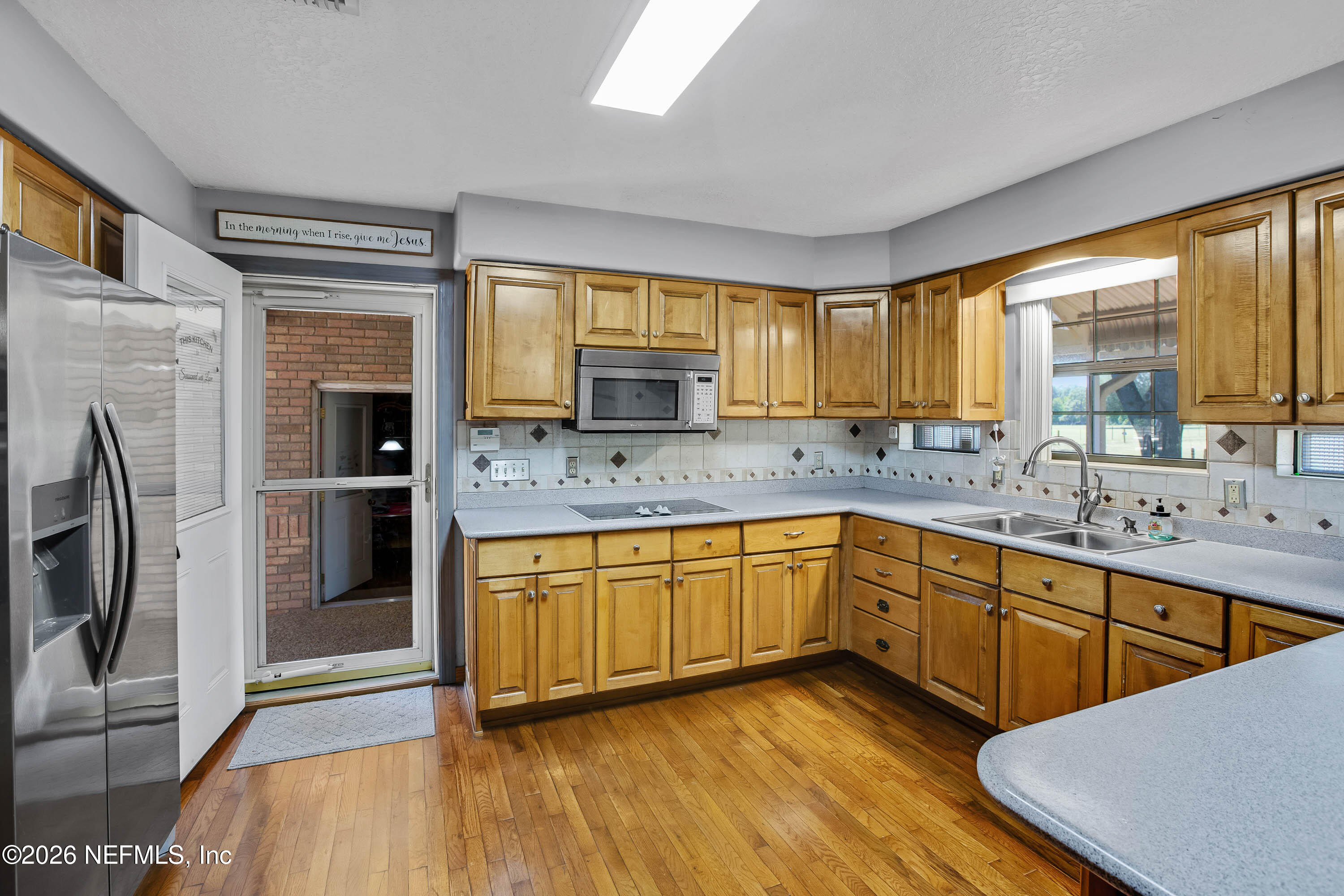 289 Chesser Road Interlachen, FL 32148 - Photo 6 of 63 a kitchen with stainless steel appliances granite countertop a sink a stove and refrigerator