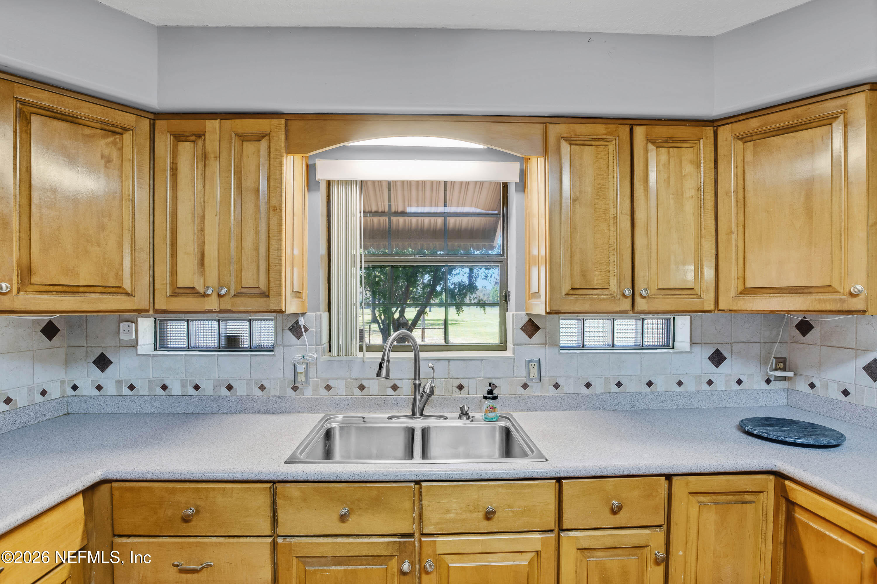 289 Chesser Road Interlachen, FL 32148 - Photo 8 of 63 a kitchen with a sink and a window