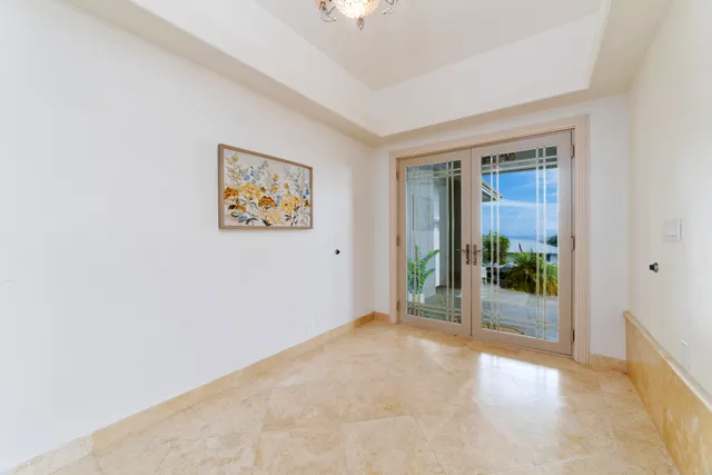 an empty room with windows and entrance