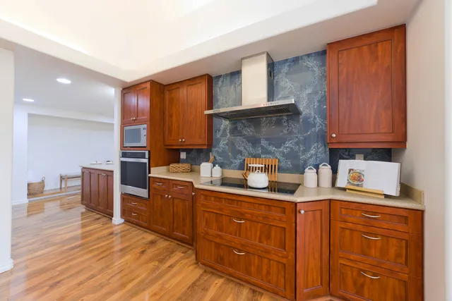 a view of a kitchen from the hallway