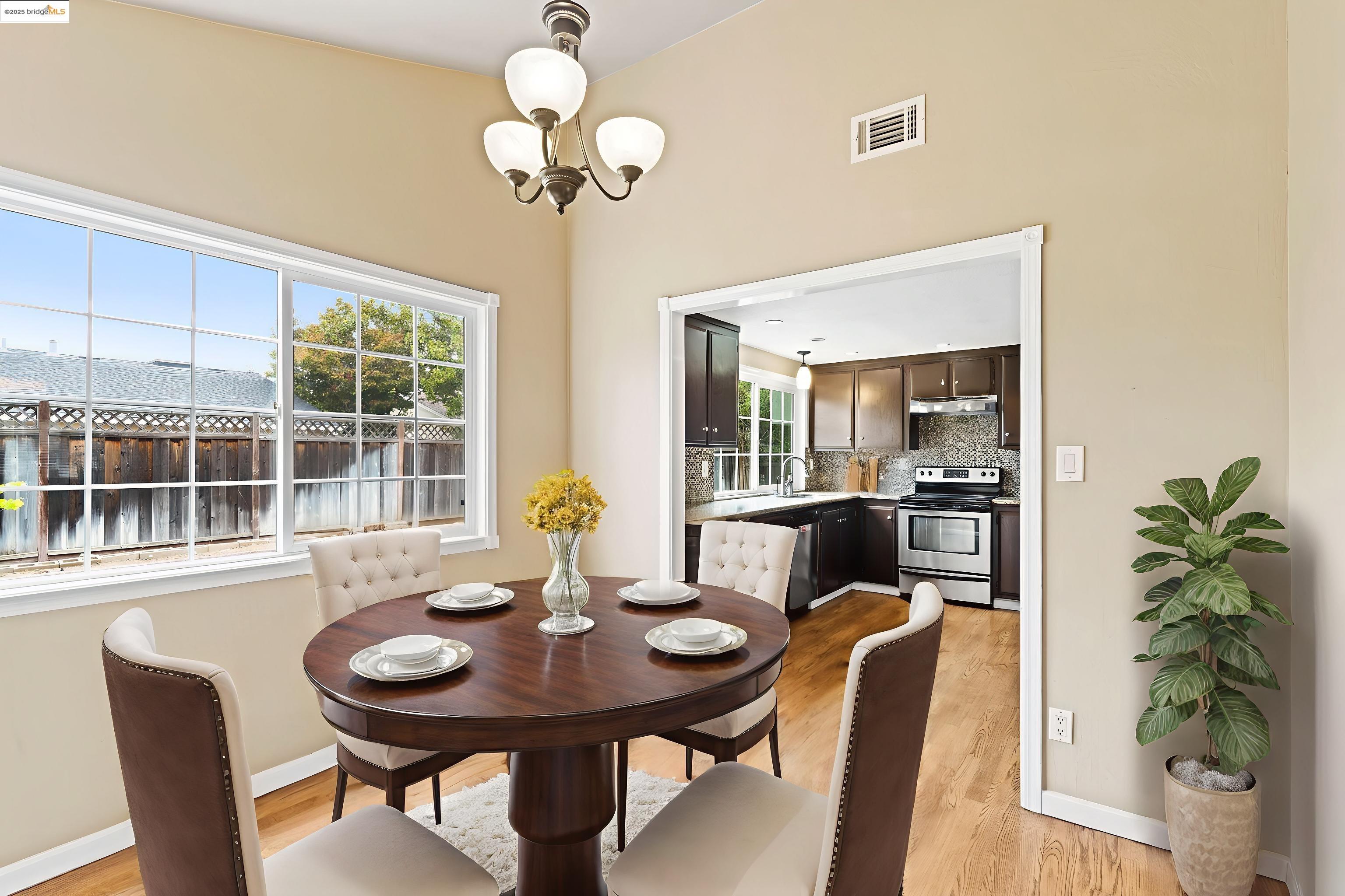 838 Hazel Street Livermore, CA 94550 - Photo 16 of 35 a view of a dining room with furniture window and wooden floor