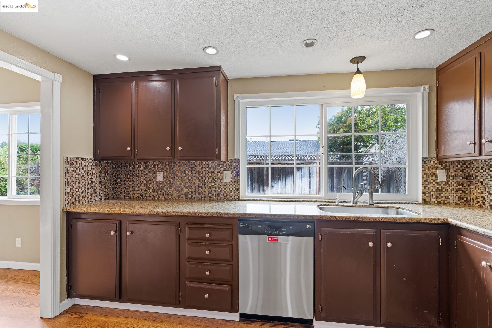 838 Hazel Street Livermore, CA 94550 - Photo 20 of 35 a kitchen with a sink and a large window